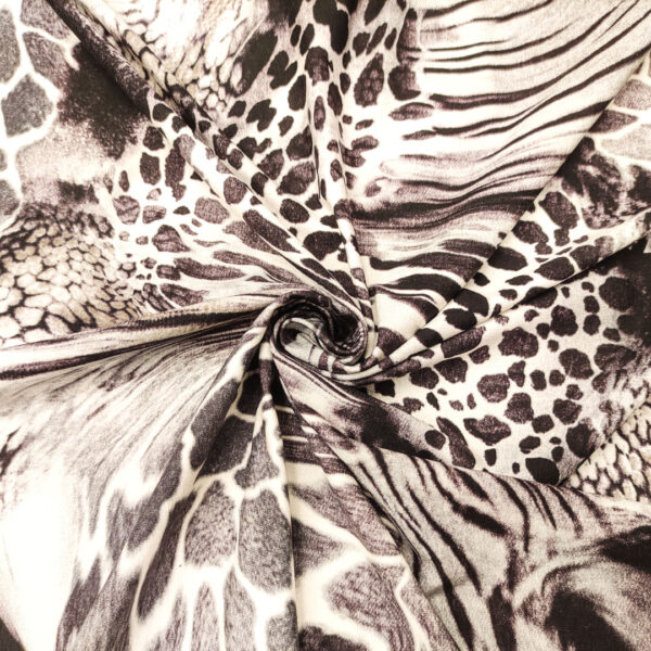 Tessuto Jersey di cotone a fantasia motivo animalier grigio - nero