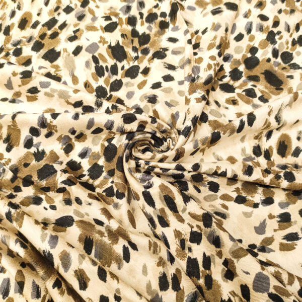 Tessuto Jersey di cotone a fantasia motivo astratto beige - grigio - nero