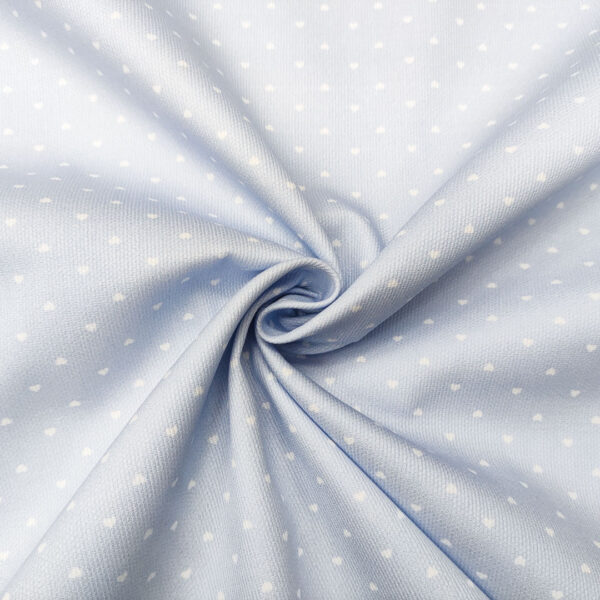 Tessuto Millerighe di Cotone a fantasia motivo cuori celeste - bianco
