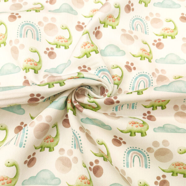 Tessuto Millerighe di Cotone a fantasia motivo dinosauri verde - bianco - tiffany