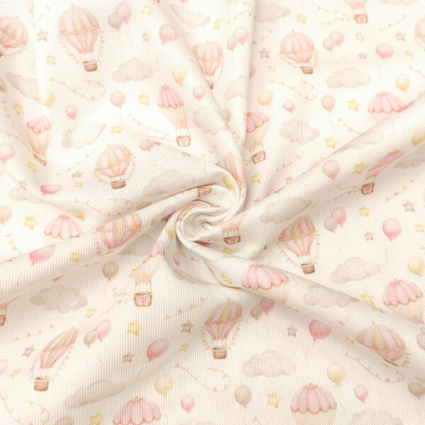 Tessuto Millerighe di Cotone a fantasia motivo mongolfiera bianco - rosa