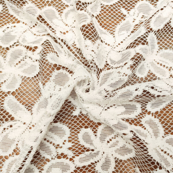Tessuto pizzo mano lana motivo floreale bianco