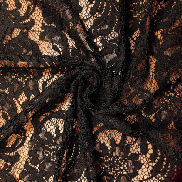 Tessuto pizzo motivo astratto floreale nero