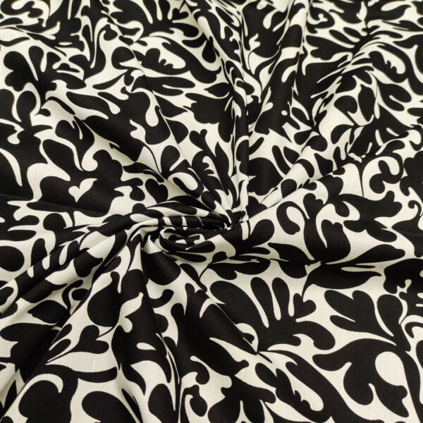 Tessuto Popeline di cotone a fantasia motivo astratto bianco - nero