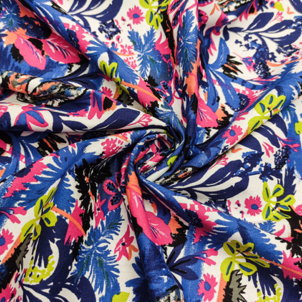 Tessuto Popeline di cotone a fantasia motivo floreale blu - fucsia - verde fluo