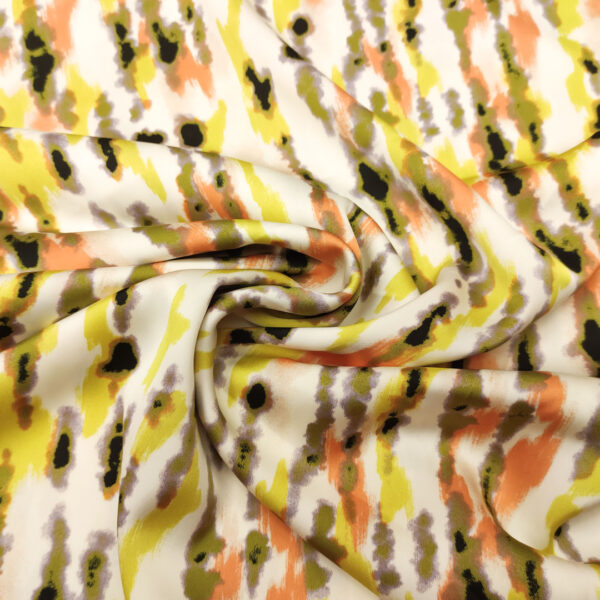 Tessuto Satin elasticizzato a fantasia motivo bianco - verde acido - arancio