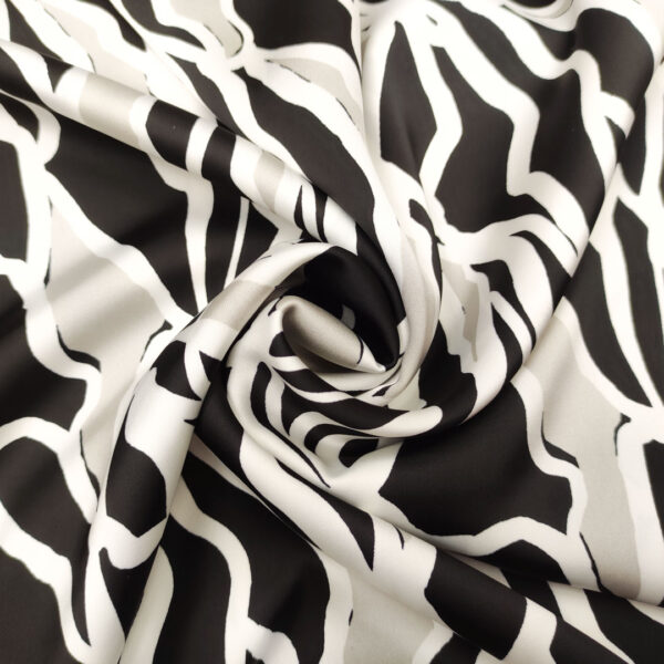 Tessuto Satin elasticizzato a fantasia motivo astratto nero - tortora - bianco