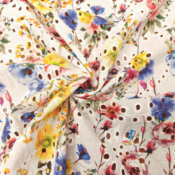 Tessuto Sangallo a fantasia motivo floreale bianco - rosso - giallo - blu