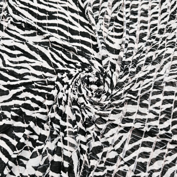 Tessuto Jersey leggero a balzine motivo animalier bianco - nero