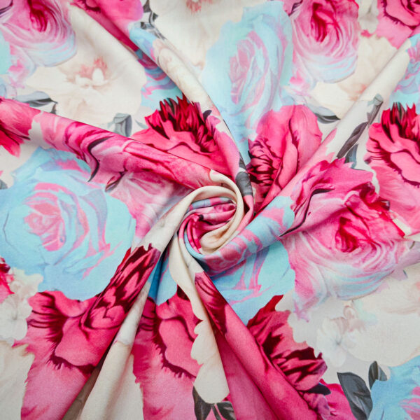 Tessuto Cady elasticizzato a fantasia motivo floreale celeste - panna - fucsia
