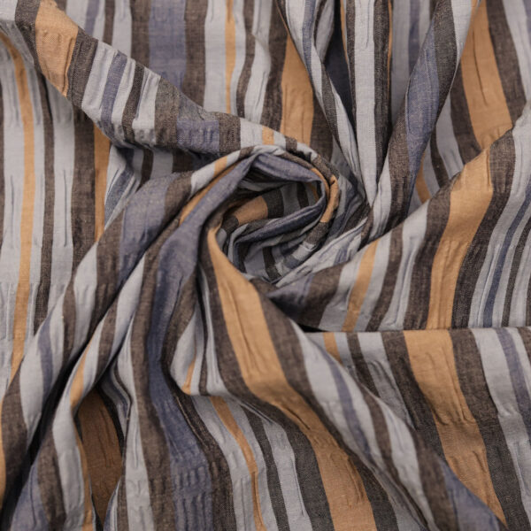 Tessuto Cotone effetto stropicciato a fantasia motivo rigato celeste - avio - beige