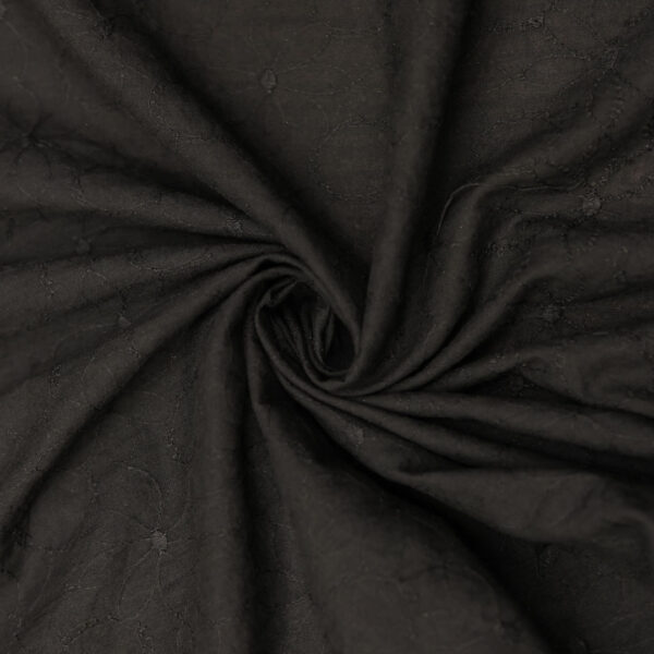 Tessuto Mussola di Cotone ricamato motivo floreale tinta unita nero