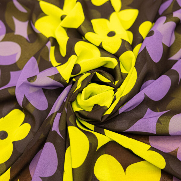 Tessuto Georgette a fantasia motivo  floreale nero viola verde fluo