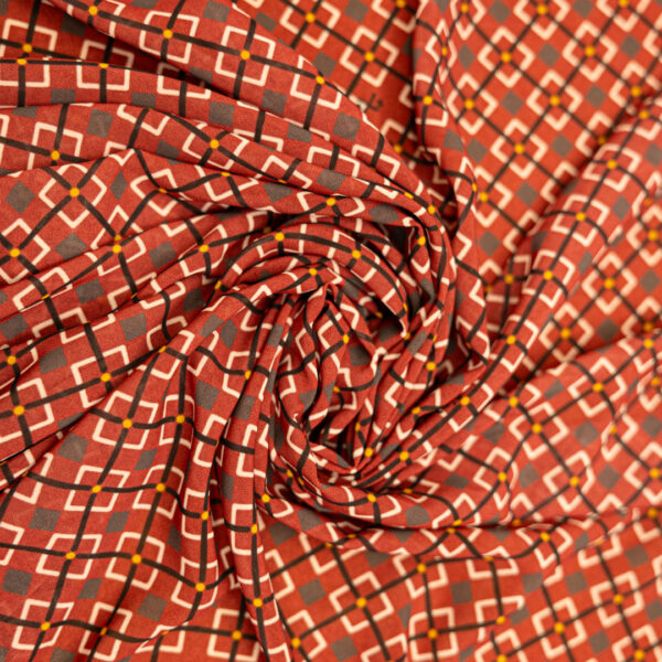 Tessuto Georgette a fantasia motivo  geometrico nero bianco bordeaux