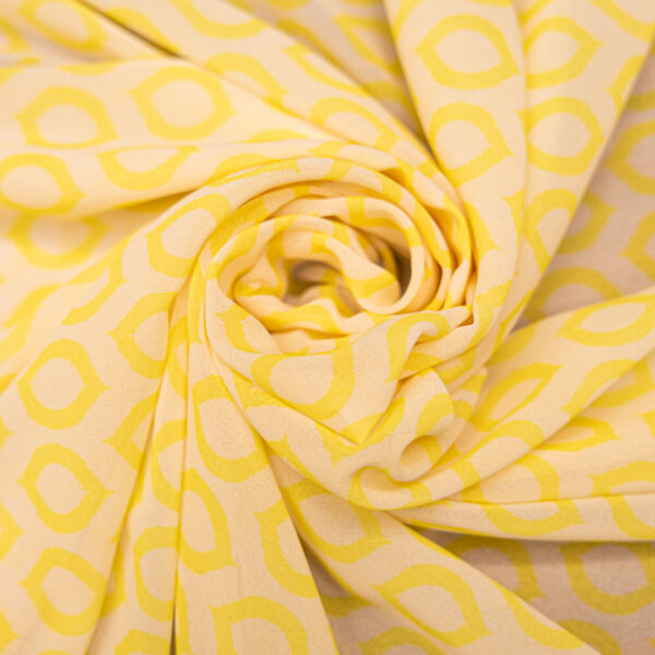 Tessuto Georgette a fantasia motivo  geometrico panna giallo