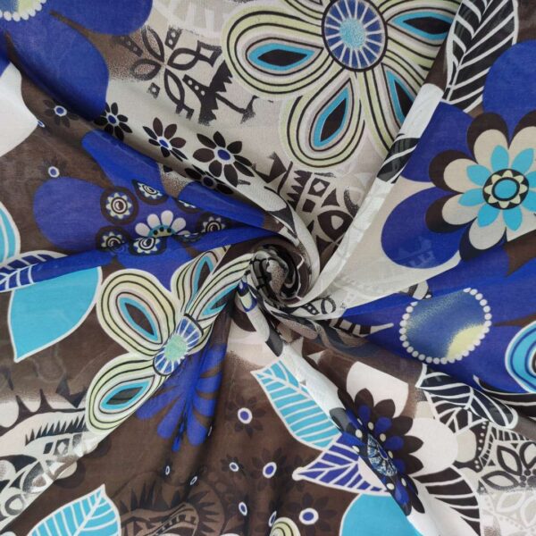 Tessuto Georgette a fantasia motivo floreale bluette nero turchese