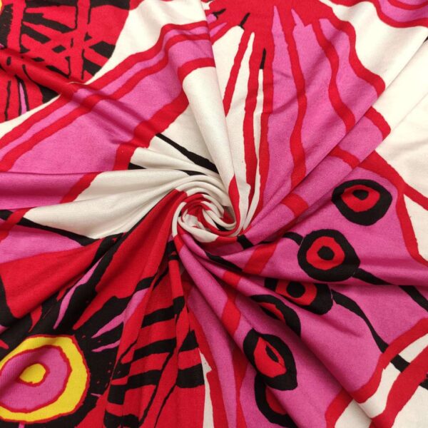 Tessuto Jersey di viscosa a fantasia motivo astratto fucsia rosso bianco giallo
